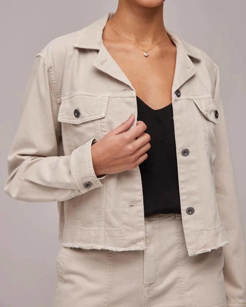 Front of a model wearing a size L Coco Cut-Off Jean Jacket in Cool Sand in Cool Sand by Bella Dahl. | dia_product_style_image_id:363461